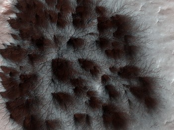 Aesthetically pleasing formations caused by sublimation of frozen carbon dioxide (dry ice) at the southern polar cap during the spring thaw (© NASA/JPL/University of Arizona).