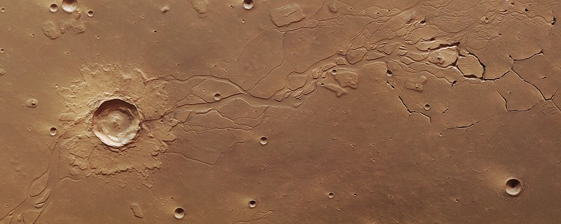 Cratère et chenaux d'écoulement dans la région d'Hephaestus Fossae (ESA/DLR/FU Berlin G. Neukum)